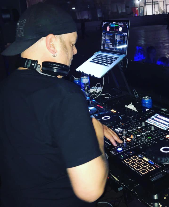 DJ Terry Bevvan mixing from the side of the booth